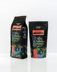 Two Swelter Coffee Bags on a white background, one bag showing the 2lb bag, and one showing the 12oz bag